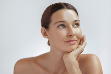 Natural Beauty Woman Resting Chin On Hand With Glowing Healthy Skin