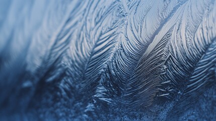 Close-up of frosty window patterns with delicate ice crystals and soft blue tones. Perfect abstract winter background for seasonal design, banners, copy space, and luxury concepts.