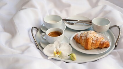 Fototapeta premium Luxury Hotel Breakfast Tray on White Bedding with Coffee and Cro