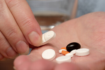 Medication routine at home in the morning with a glass of water