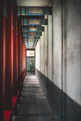 A close-up view unveils the ancient building details within Beijing's Summer Palace, China. The corridor showcases intricate architectural features.