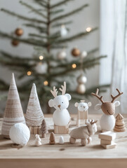 Toys made from recycled paper, fabric, and wood sit on a wooden table. A Christmas theme.