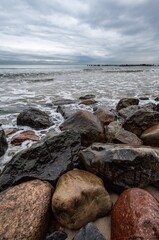 boulders and wooden breakwaters on the beach