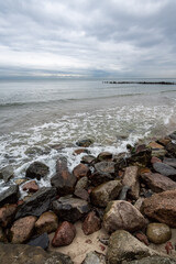 boulders and wooden breakwaters on the beach