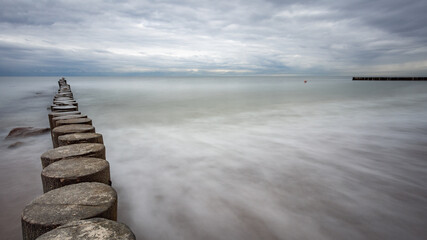 boulders and wooden breakwaters on the beach
