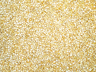 Pile of uncooked white quinoa background
