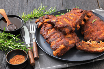 bbq baby pork ribs with fresh rosemary on a plate