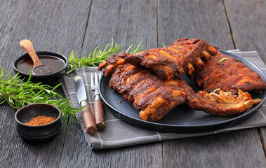 bbq baby pork ribs with fresh rosemary on a plate