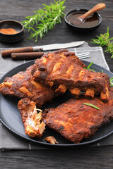 bbq baby pork ribs with fresh rosemary on a plate