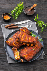 bbq baby pork ribs with fresh rosemary on a plate