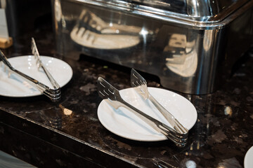 elegant dining setup, luxurious table setting featuring pristine dishes and shining cutlery