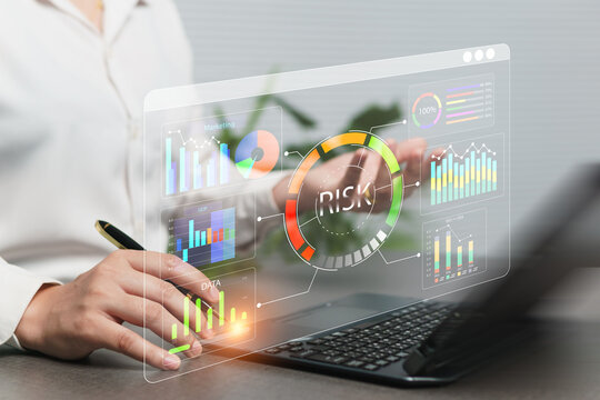 Businesswoman assesses business and financial investment risks using strategic analysis charts and predicts stock market volatility with artificial intelligence technology to eliminate risks.