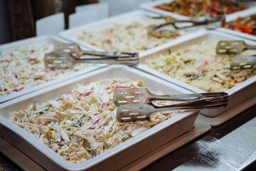 restaurantstyle salad display arrangement, informal selfserve food station featuring cold salads