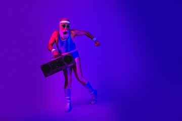 Fototapeta premium Retro fitness icon dances with a boombox in a neon purple studio wearing a blue jumpsuit and retro style gear