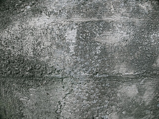 Worn and weathered wall surface texture background dark gray color