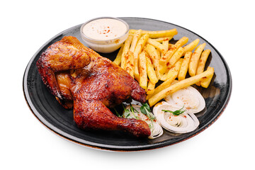 Crispy grilled chicken with fries and sauce served on a black plate