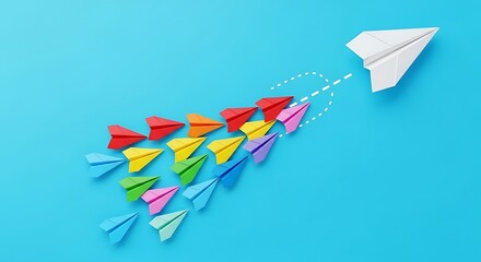 A single white paper airplane leads a colorful flock of smaller paper airplanes in formation against a blue background