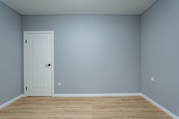 blank room suitable for decorating projects, unfinished gray room ready for personalized interior design, empty space with neutral tones ideal for home decor and layout planning