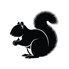 Silhouette of a squirrel holding a nut and its bushy tail high