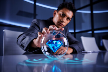 Man holding a crystal ball with a diamond inside