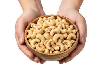 Hands holding a wooden bowl full of cashews