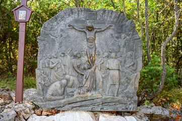 Station XII of the Way of the Cross: Jesus dies on the Cross. The Way of the Cross on Mount Križevac (the Cross Mountain) in Medjugorje.