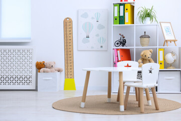 Height measuring chart, toys and furniture indoors