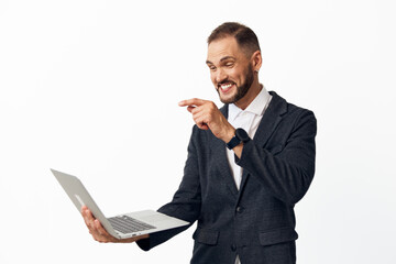 A corporate professional man with a laptop radiates confidence and energy against a bright isolated...
