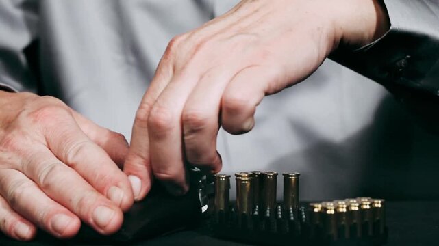 Loading of small personal two barrel derringer handgun of .38 special caliber ammunition