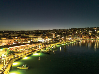 Sitia by night – Aerial view Illuminated by coastal lights