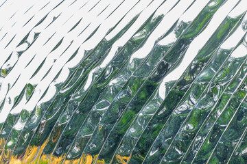 Abstract glass pattern with reflections of nature and geometric shapes