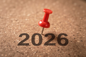 Year 2026 message red pushpin pinning number 2026 on cork board texture background new year celebration