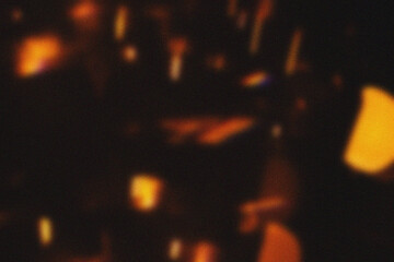 Red light effect on black background. Abstract wallpaper. Analog film effect. Blurred defocused. Lo-fi effect