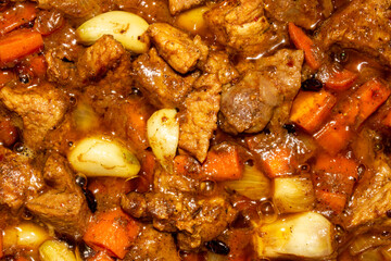 Roast with meat for pilaf.Filling for pilaf.Roast meat with carrots and onions.Toasted meat background.