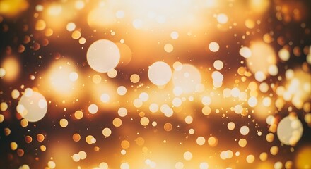 Abstract background of glowing golden bokeh lights creating a warm and festive atmosphere.