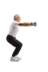 Fit senior man exercising squats with dumbbells