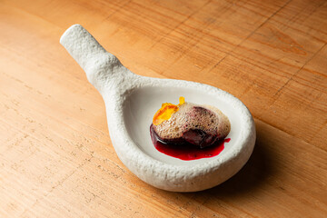 Designer dessert with cherries and foam
