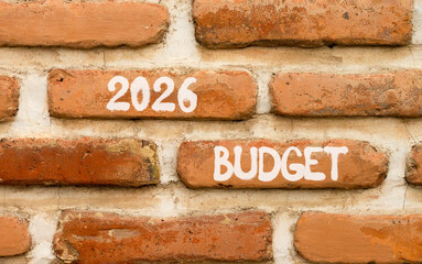 2026 Budget symbol. Concept words 2026 Budget on beautiful brown brick wall. Beautiful brown brick wall background. Business and 2026 budget concept. Copy space.