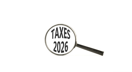 Taxes 2026 new year symbol. Concept words Taxes 2026 on beautiful white paper. Black magnifying glass. Beautiful white paper background. Business and taxes 2026 new year concept. Copy space.