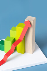 Moving up business or finance 3D graph and chart still life. Blue background.