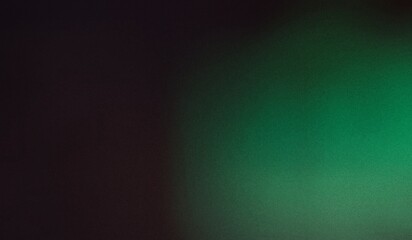 Abstract grainy background with dark black and vibrant green gradient. The entire image has a prominent grainy or noise texture, perfect for use as a moody backdrop