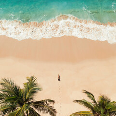 Aerial View of Woman Walking on Tropical Beach