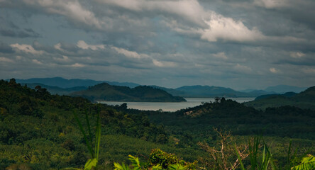 The landscape features vast green hills stretching into the distance can see the islands in the sea. Ranong, Thailand.
