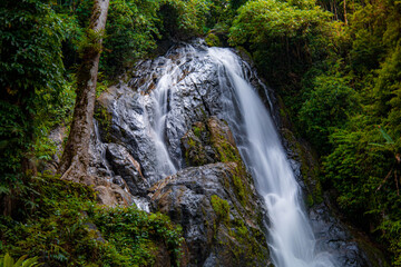 Naklejka premium A gorgeous waterfall captured in long exposure, Punjaban Waterfall, national park, Ranong, Thailand.