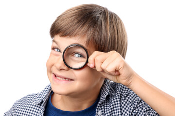 Little boy with magnifying glass on white background