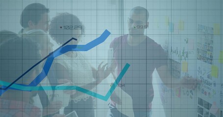 Brainstorming team members pointing at glass partition in office meeting area, sticky notes display