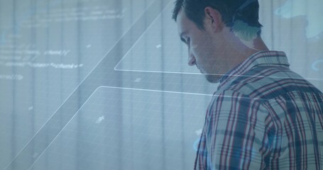 Manipulating male engineer interacting with holographic interface in office, grid text, copy space