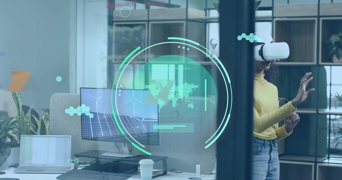 Reaching out woman wearing yellow sweater and VR headset in office with holographic map, copy space