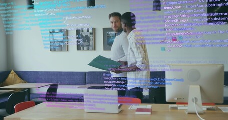 Discussing software tasks coworkers standing at table in office, with laptop and code overlay