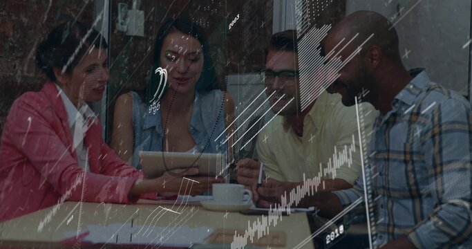 Analyzing professionals wearing blazers reviewing graphs at conference room, with tablet computer